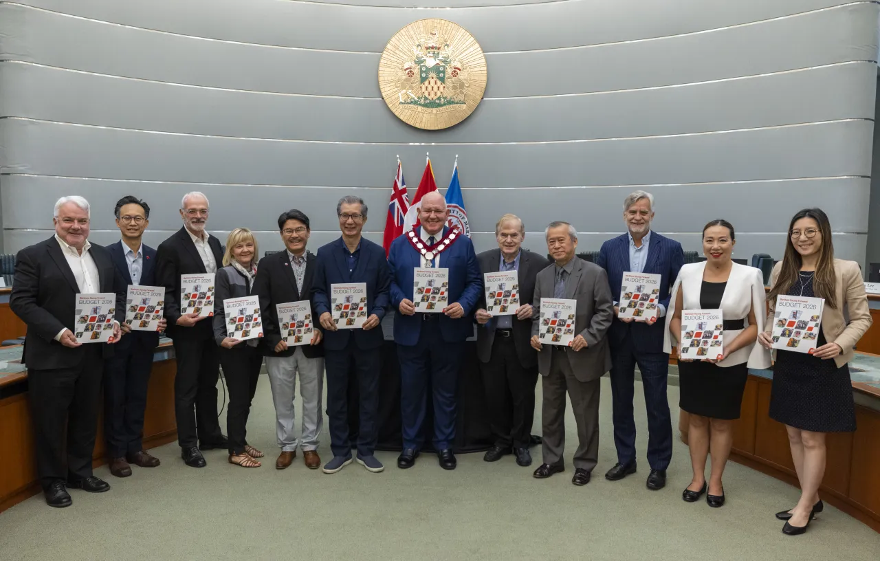 City of Markham's Mayor and councilors holding 2026 budget booklets.