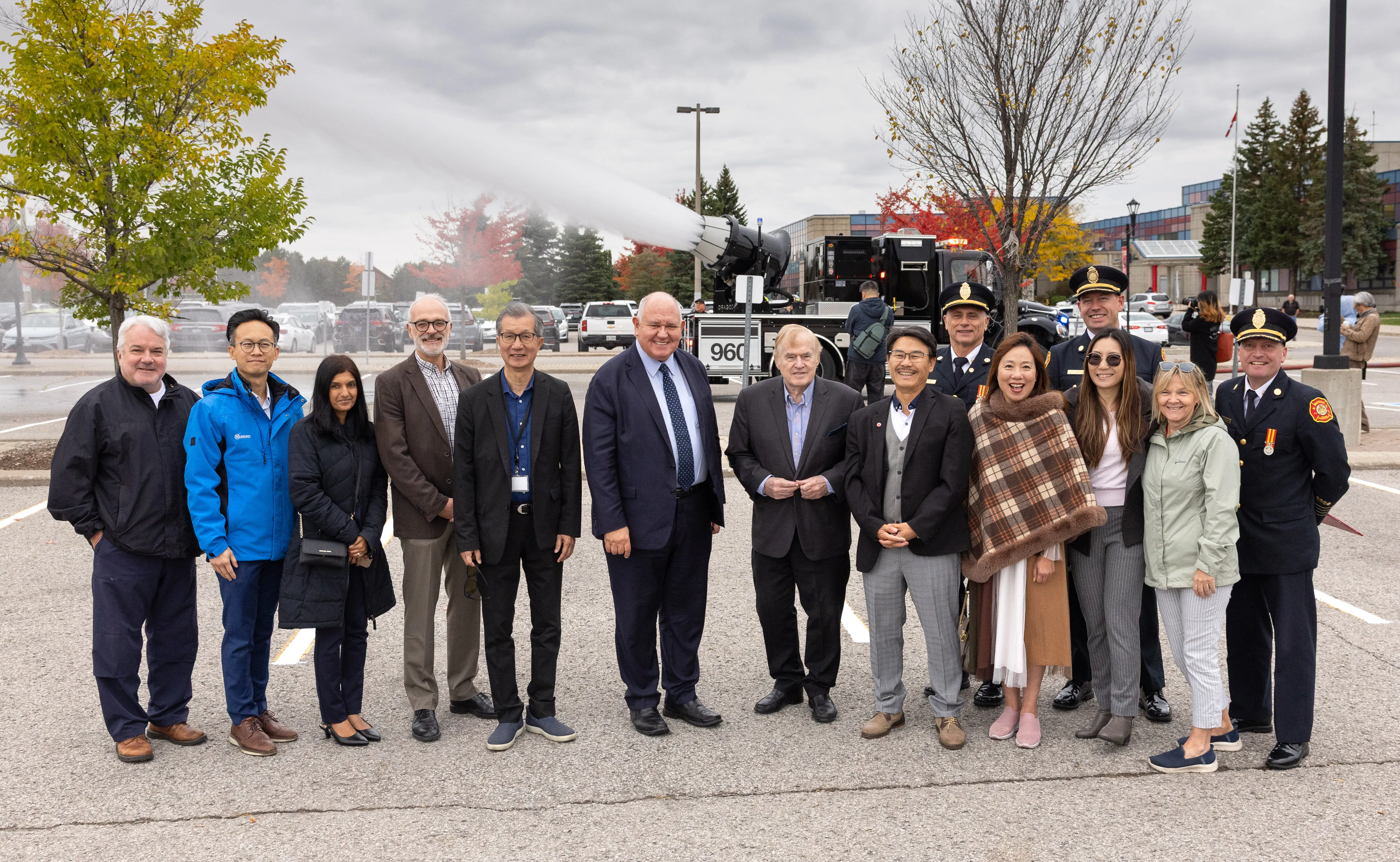 Councillor Ward 1 Keith Irish, Councillor Ward 2 Ritch Lau, Councillor Ward 7 Nimisha Patel, Councillor Ward 3 Reid McAlpine, Deputy Mayor Michael Chan, Mayor Frank Scarpitti, Regional Councillor Jim Jones, Regional Councillor Alan Ho, MFES Chief Chris Nearing, Councillor Ward 6 Amanda Yeung Collucci, Deputy Fire Chief Robert Garland, Councillor Ward 8 Isa Lee, Councillor Ward 4 Karen Rea, and Deputy Fire Chief Ryan Best at the Markham Civic Centre on Oct. 21, 2025.