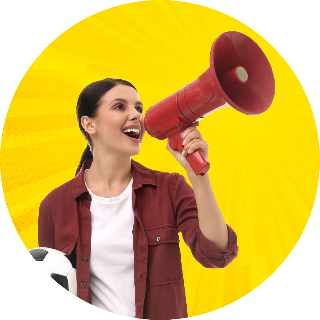 Women shouting in megaphone holding a soccer ball 