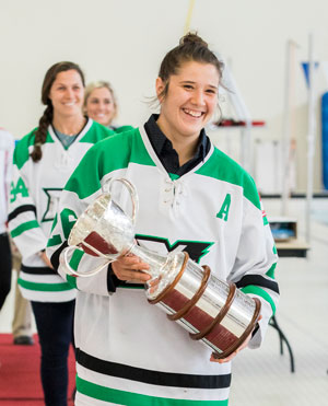 image of Markham Thunder's Jamie Lee Rattray leads the Markham Sport Hall of Fame athlete procession carrying the Clarkson Cup.